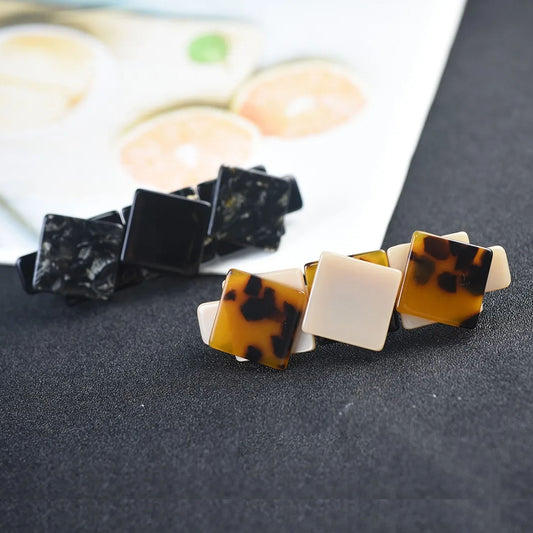 Three-cube hair clips